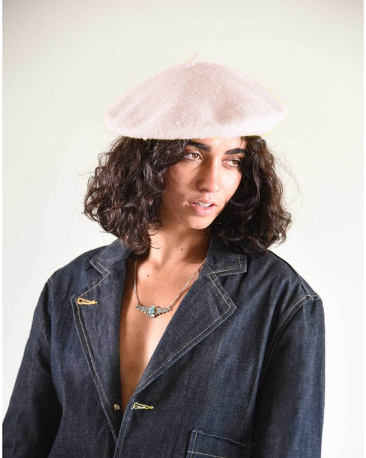 Model wearing The Belle Beret – Lilac Cream, styled with a relaxed jacket. The soft lilac cream tone adds a romantic, Parisian-inspired edge to any look.