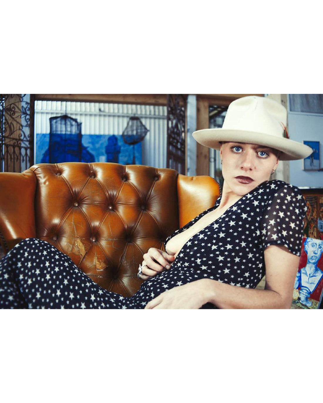 woman wears Cream Bromley Felt Hat, structured wool felt fedora with ribbon band and UPF 50+ sun protection.