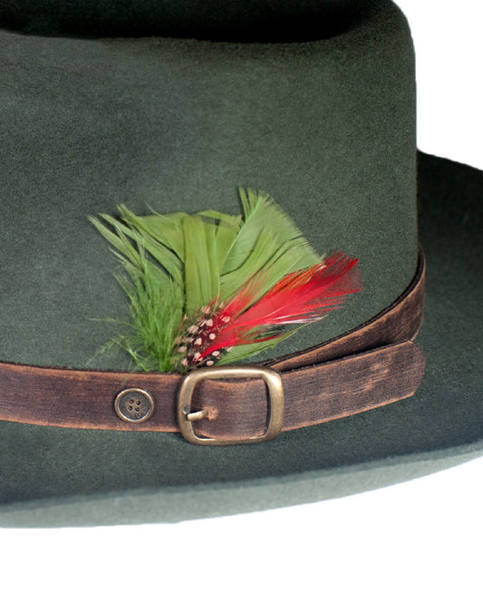 The Bromley Felt Hat in Forest Green, showcasing rich wool texture, worn leather detailing, and artisan craftsmanship. A timeless unisex piece inspired by art and adventure.
