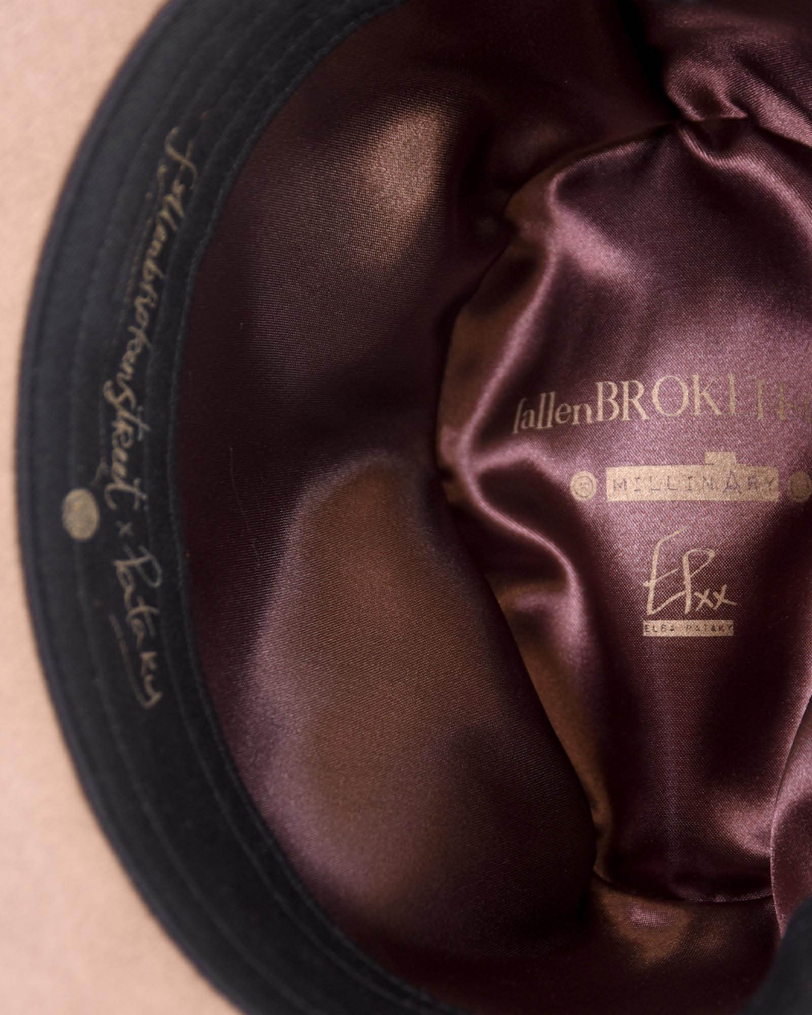 Interior shot of the EP Vintage Hat revealing the deep brown satin lining and adjustable cotton band. Offers a comfortable fit and signature FallenBROKENstreet branding.