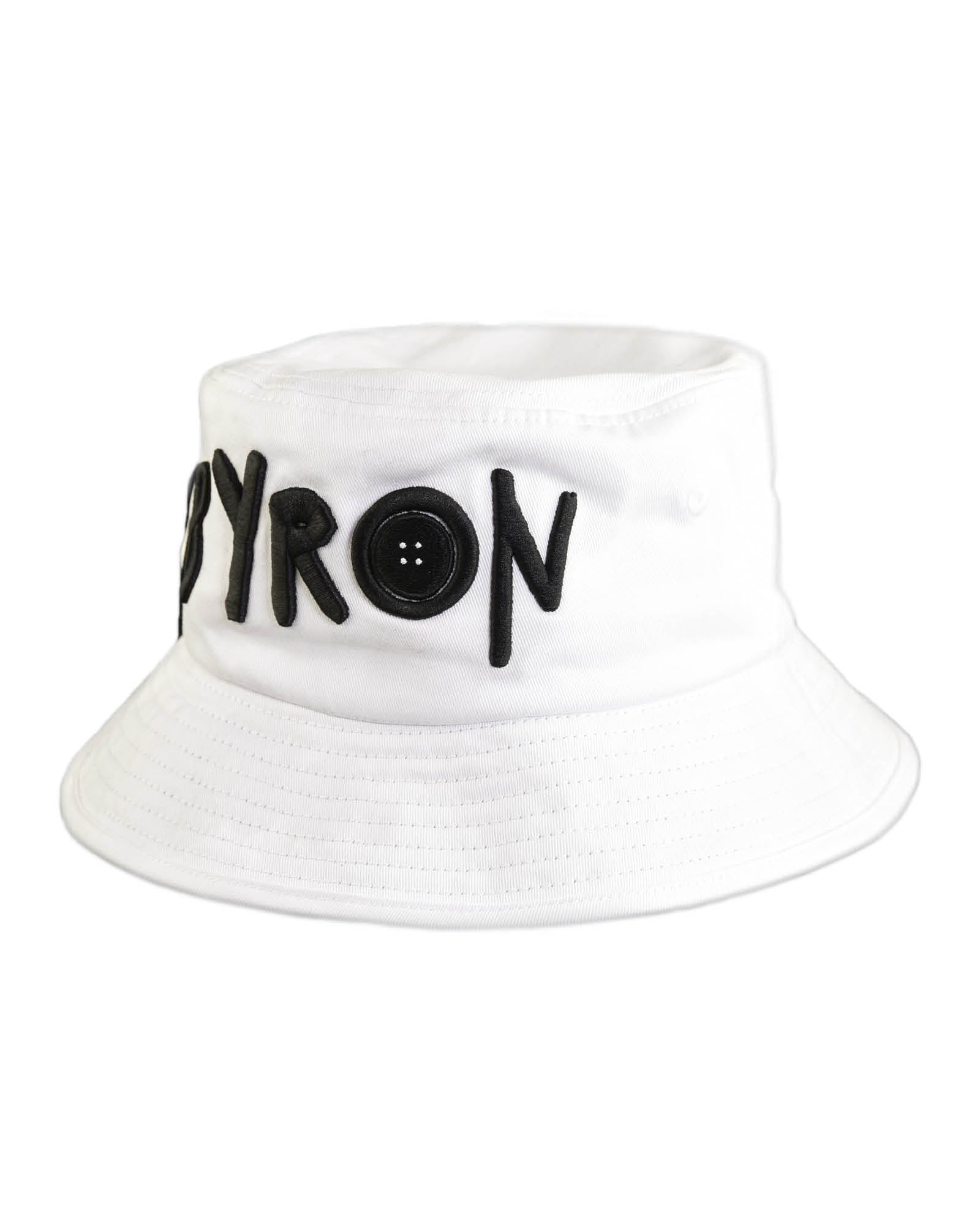 White cotton twill bucket hat featuring bold black "BYRON" embroidery on the front, designed by Fallenbrokenstreet. A lightweight, sun-ready unisex hat representing Byron Bay culture.