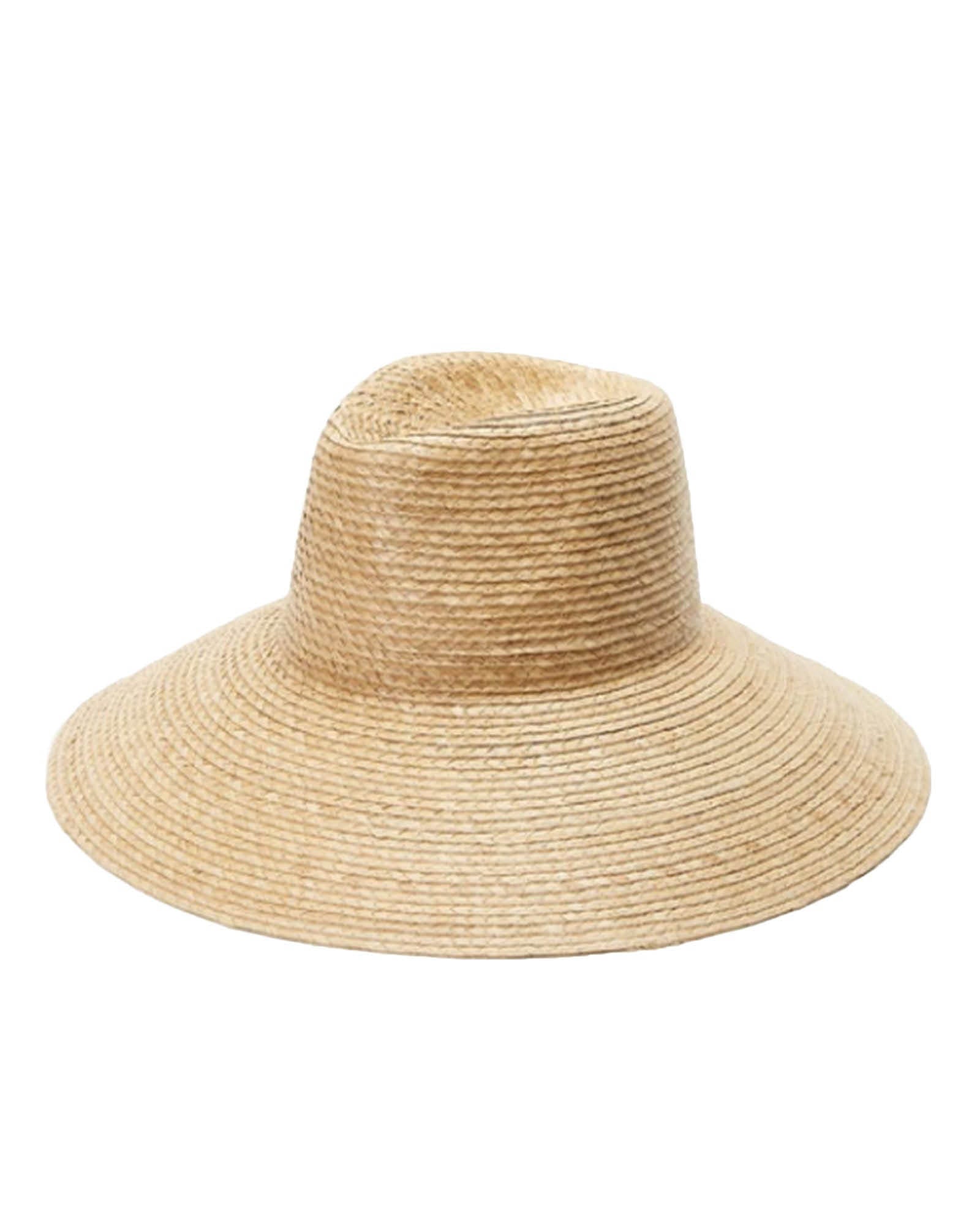 The Holiday Straw Hat by FallenBROKENstreet in natural palm straw. Wide 12 cm brim and 9 cm crown with cotton elastic inner band and metal button detail. A timeless wide-brim summer hat offering UPF 50+ protection and relaxed, coastal elegance.