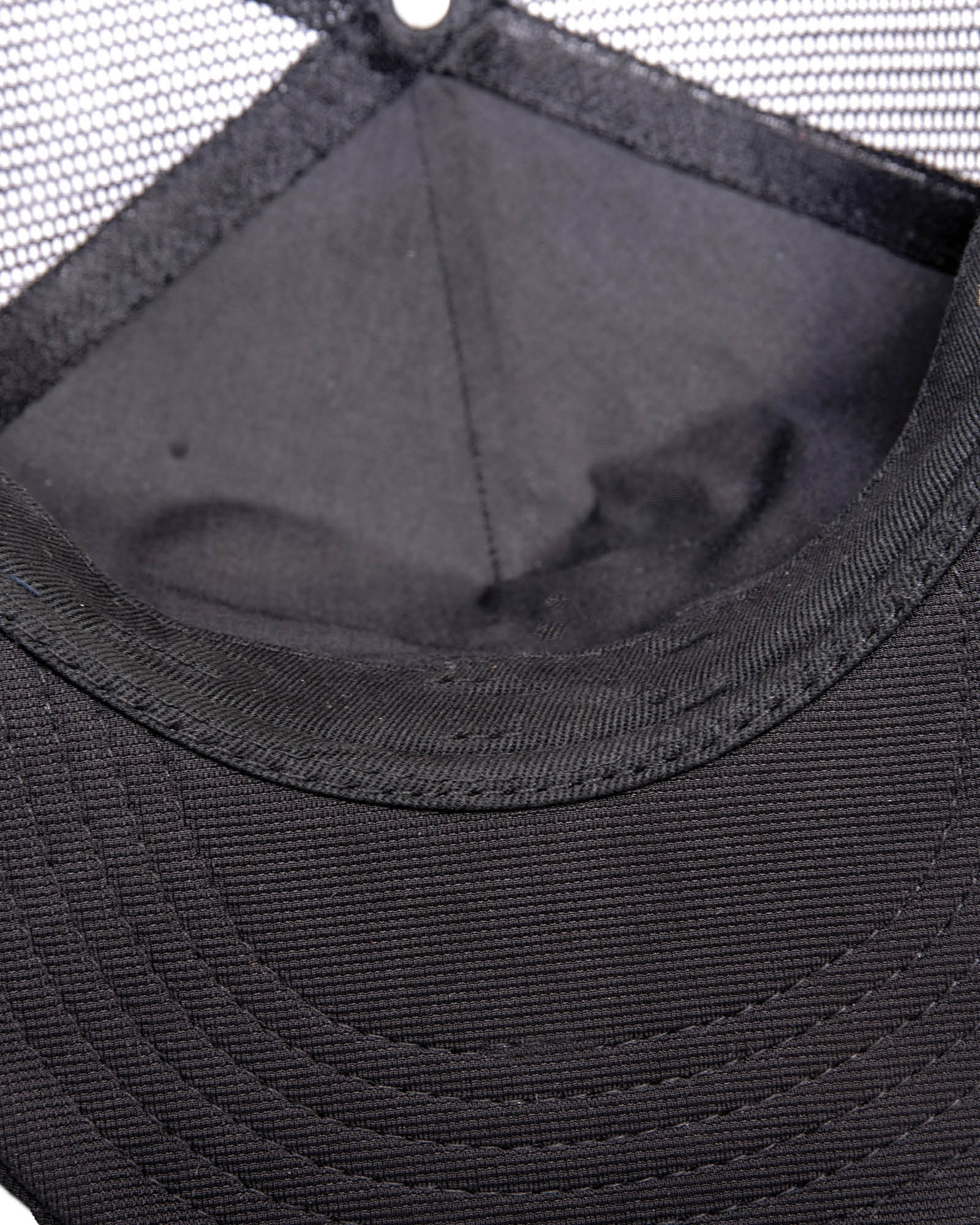 Inside top view of the cap showing mesh and cotton panel stitching