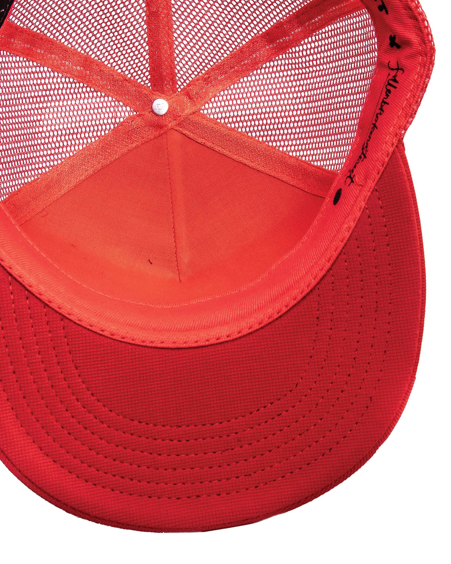 Interior construction of red mesh trucker cap – FallenBROKENstreet Strum Cap with signature details
