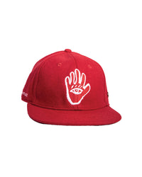 Front-facing image of the Marty Baptist x FallenBROKENstreet Miracle Eye Cap in red, made from 100% Australian wool felt. Features embroidered hand-eye graphic on the front and structured crown. Limited edition wool hat, perfect for streetwear and art lovers. Shop artist collaborations at FallenBROKENstreet online