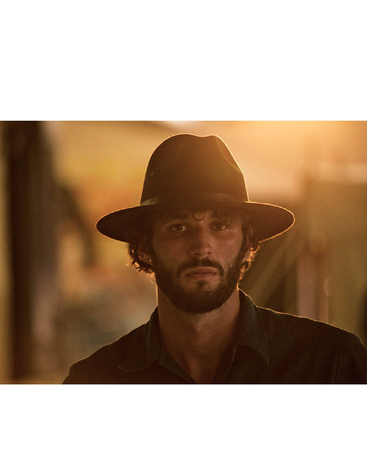 Close-up of The Crushable Ratatat Felt Hat showing fine wool texture, stitched brim, and debossed leather band.
