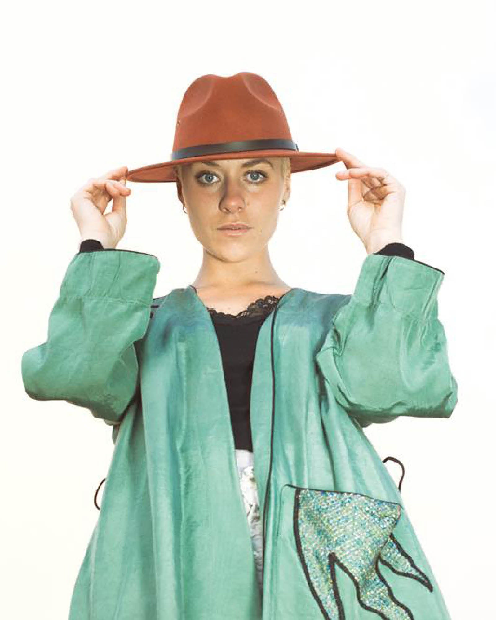 Model wearing The Ratatat Felt Hat – Rust at The David Bromley Estate. Unisex wool felt fedora with cotton inner band and UPF 50+ protection.