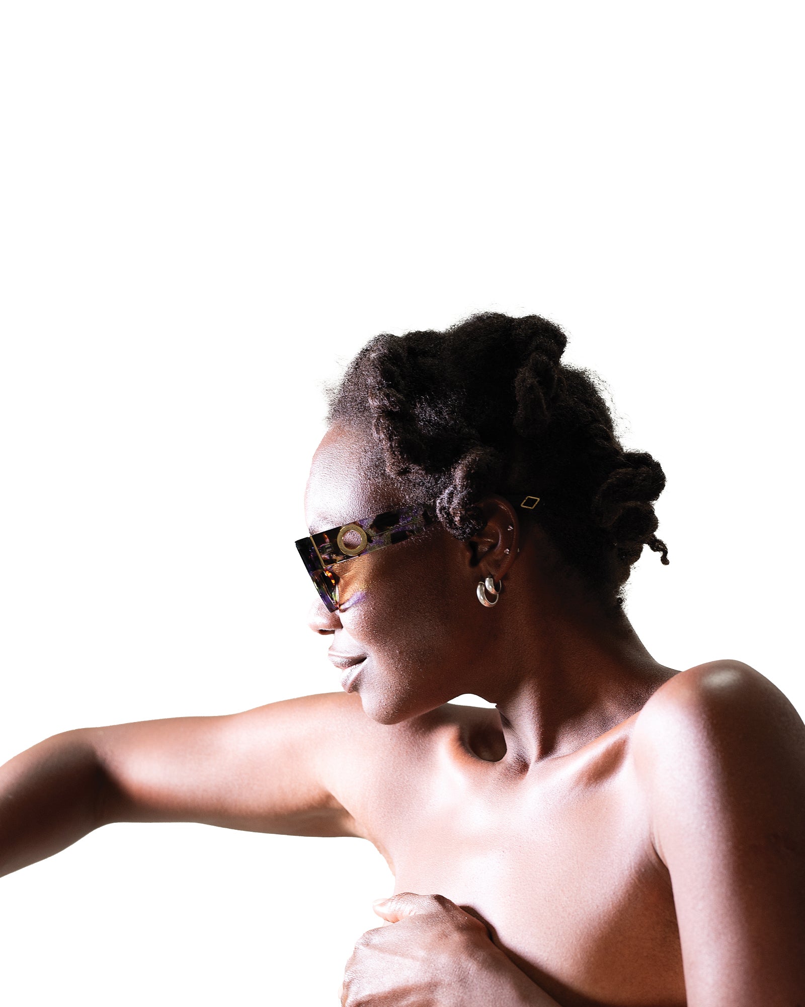 Female model with short hair poses in The Cosmos – Moondust/Amber sunglasses. Captures fashion-forward attitude, amber lenses and bold acetate frame in a clean minimalist setting.