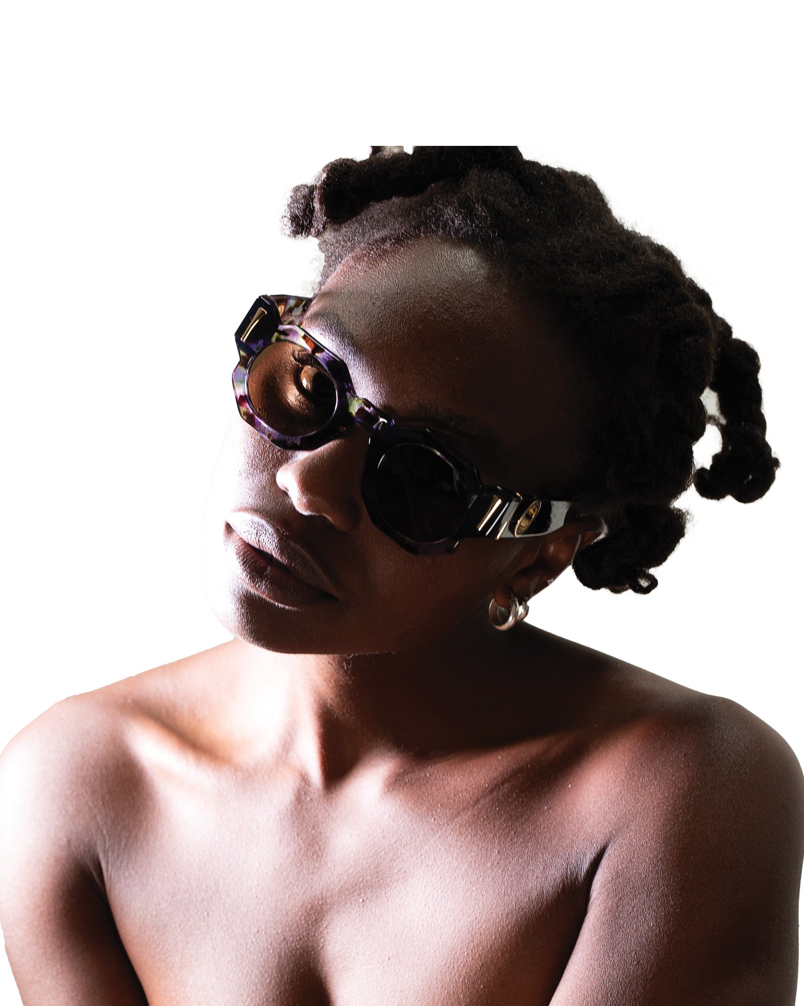 Warm-toned shot of model glowing in The Cosmos sunglasses. Highlights fashion lifestyle vibe and golden amber lenses for campaign and Shopify alt image use.
