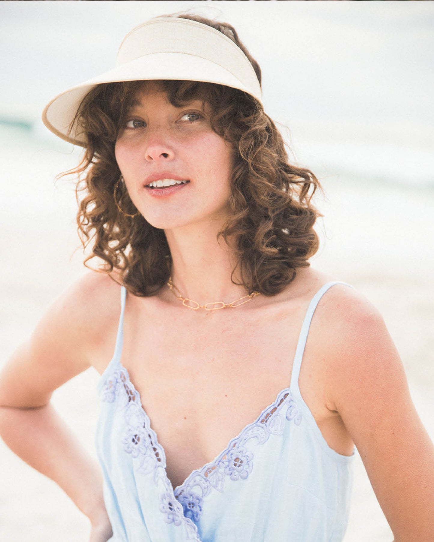 The Vision Hat Natural, unisex cotton PVC visor with adjustable elastic back.