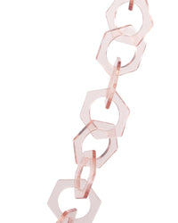 Detailed view of the SUPERNATURAL Chain in clear pink by Fallenbrokenstreet. This close-up highlights the chunky, hexagonal link design and subtle translucent hue. Perfect accessory for summer festivals, beach days, or everyday sunwear style.