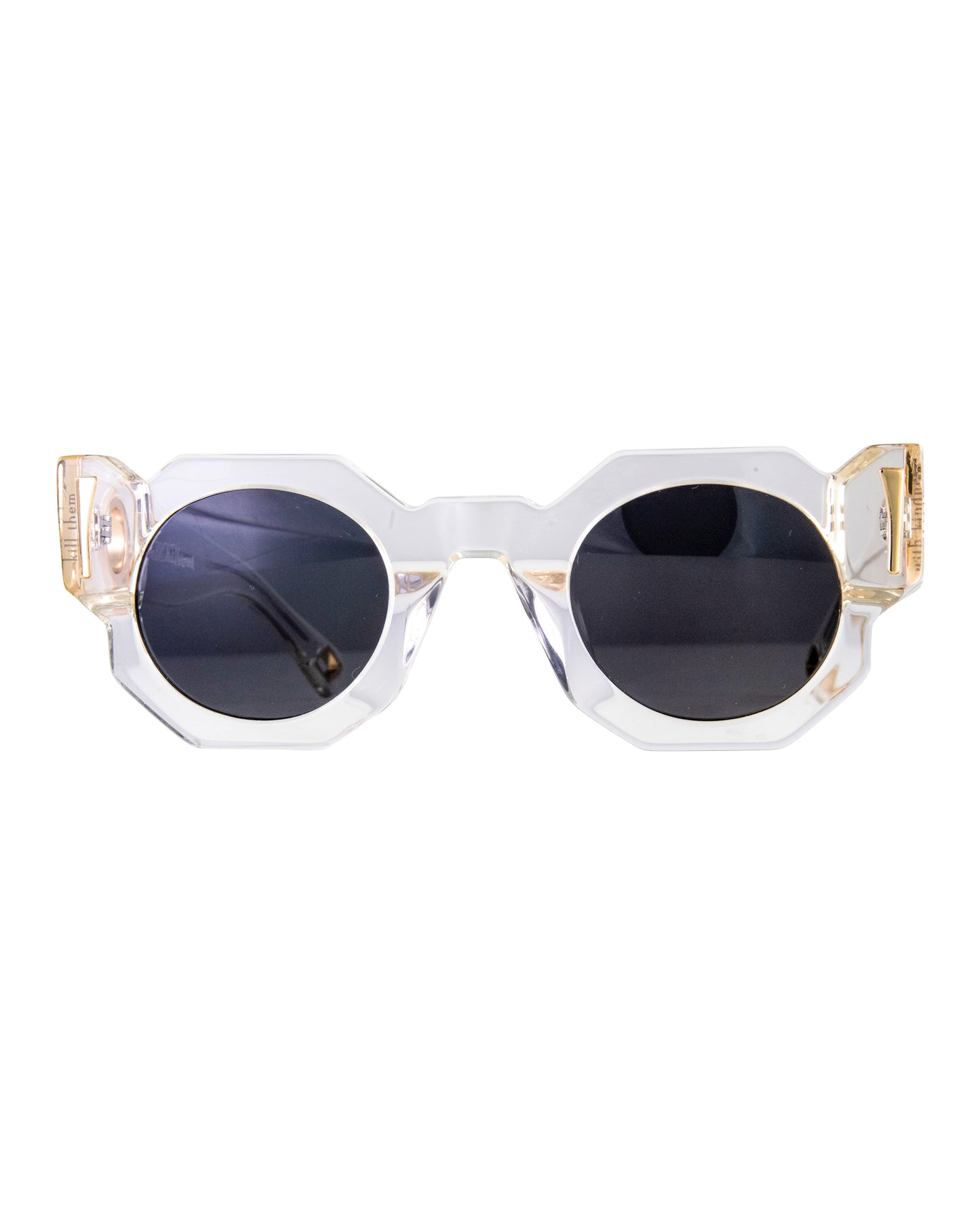 Close-up product image of Fallenbrokenstreet’s The Cosmos sunglasses in Skywalker/Black. Featuring a clear acetate frame with black polarised lenses and 24k gold finishings, ideal for bold, fashion-forward styling. Chain-compatible front and back. Perfect hero shot for Shopify or social media.