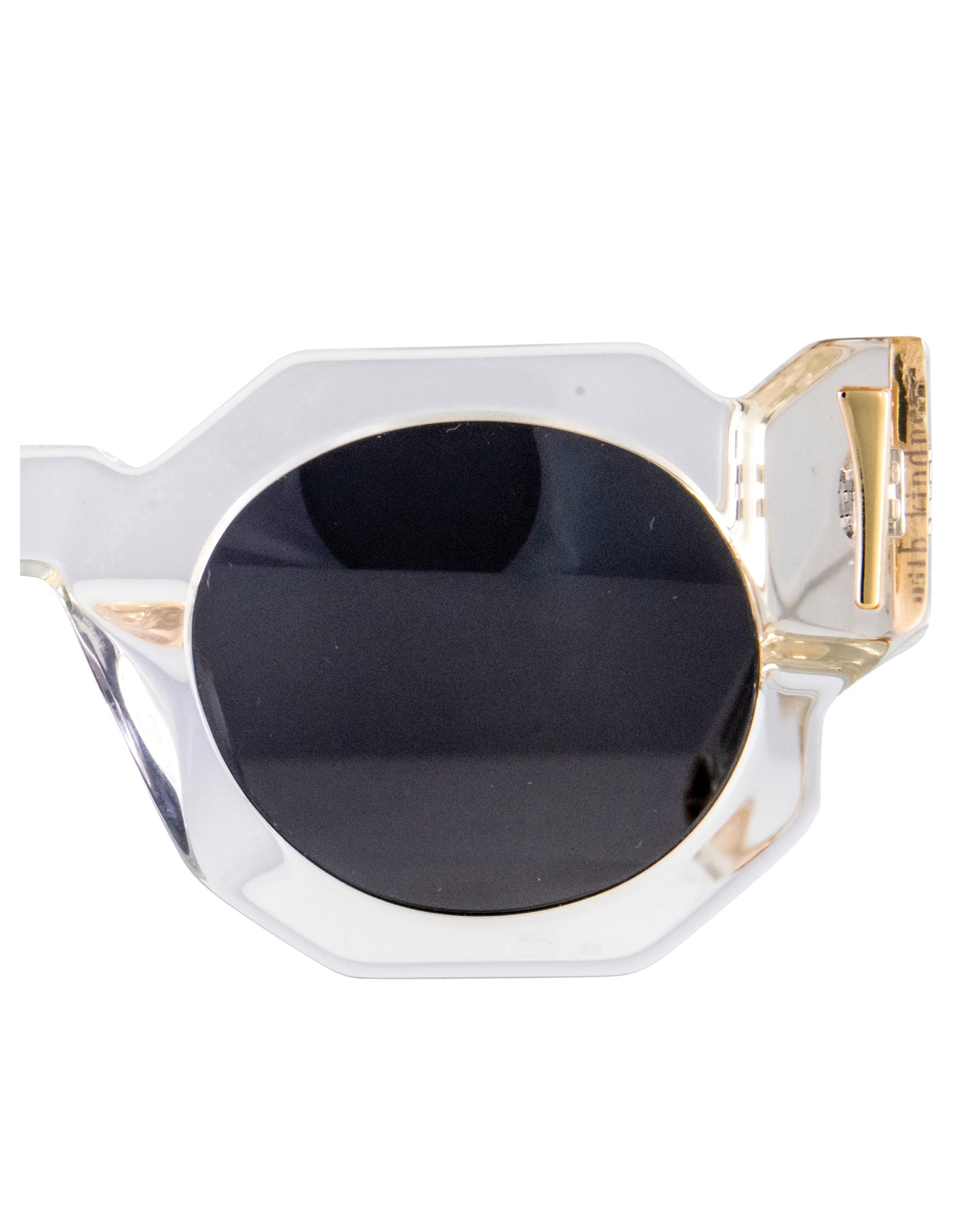 Detailed image of the rear arms of Fallenbrokenstreet’s The Cosmos – Skywalker/Black sunglasses, showcasing 24k gold accent and transparent frame. Crystal acetate and embedded gold loops for dual chain compatibility. Shot highlights the hidden “Kill Them With Kindness” engraving.