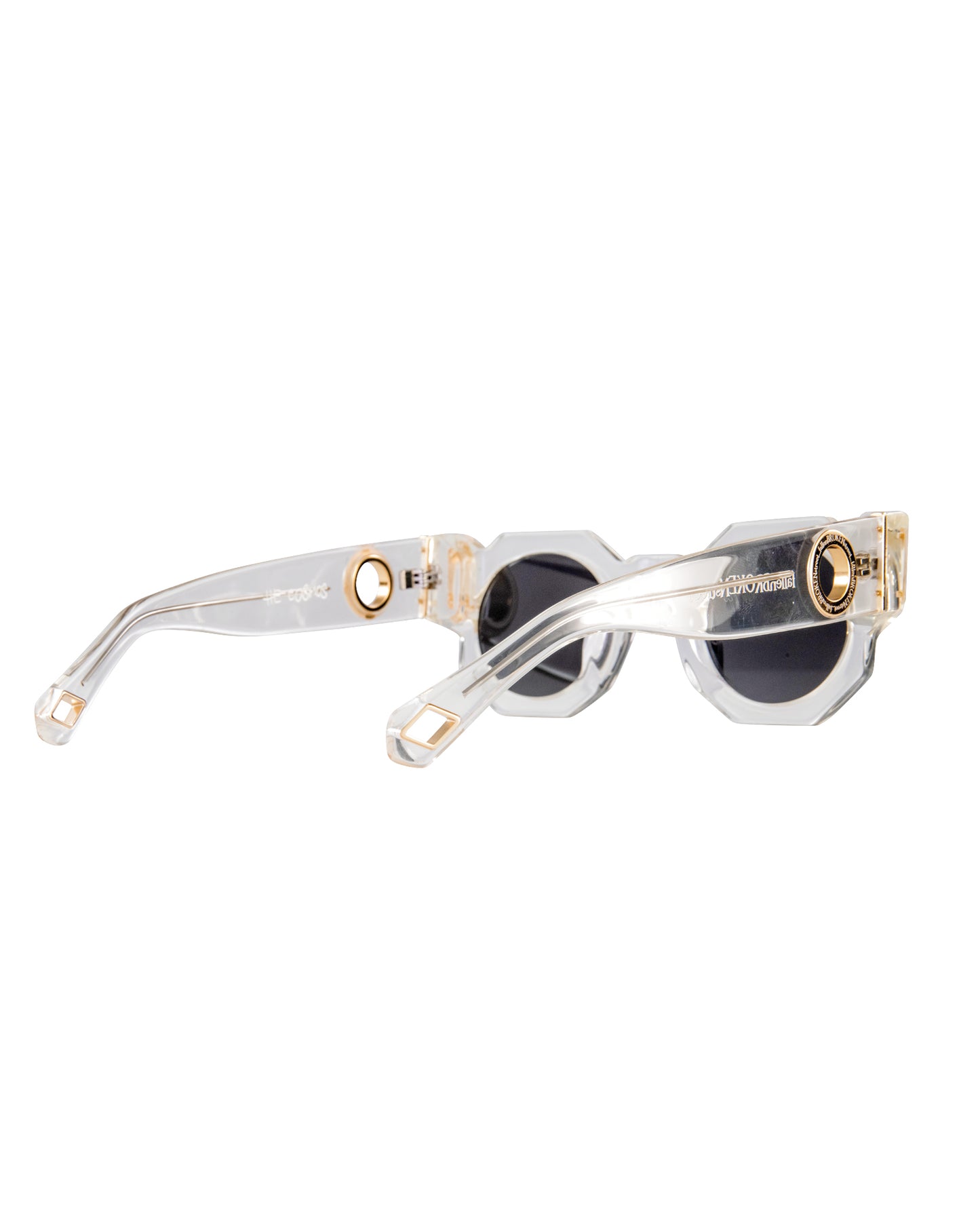 Macro image of the temple and arm cap of The Cosmos sunglasses. Highlights the subtle “Kill Them With Kindness” engraving and gold chain hoop feature. Emphasises uniqueness, finish, and functionality for chain styling.