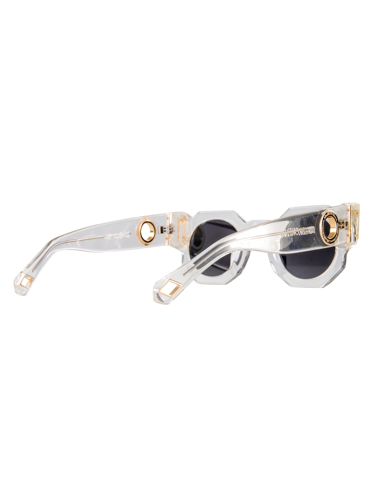 Macro image of the temple and arm cap of The Cosmos sunglasses. Highlights the subtle “Kill Them With Kindness” engraving and gold chain hoop feature. Emphasises uniqueness, finish, and functionality for chain styling.