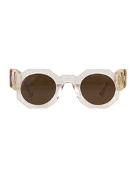 Studio image of The Cosmos sunglasses in Skywalker/Amber by Fallenbrokenstreet. Features clear acetate frame with amber-tinted polarised lenses and 24k gold accents. Showcases geometric shape and clean silhouette. Perfect for ecommerce thumbnails or primary product image.
