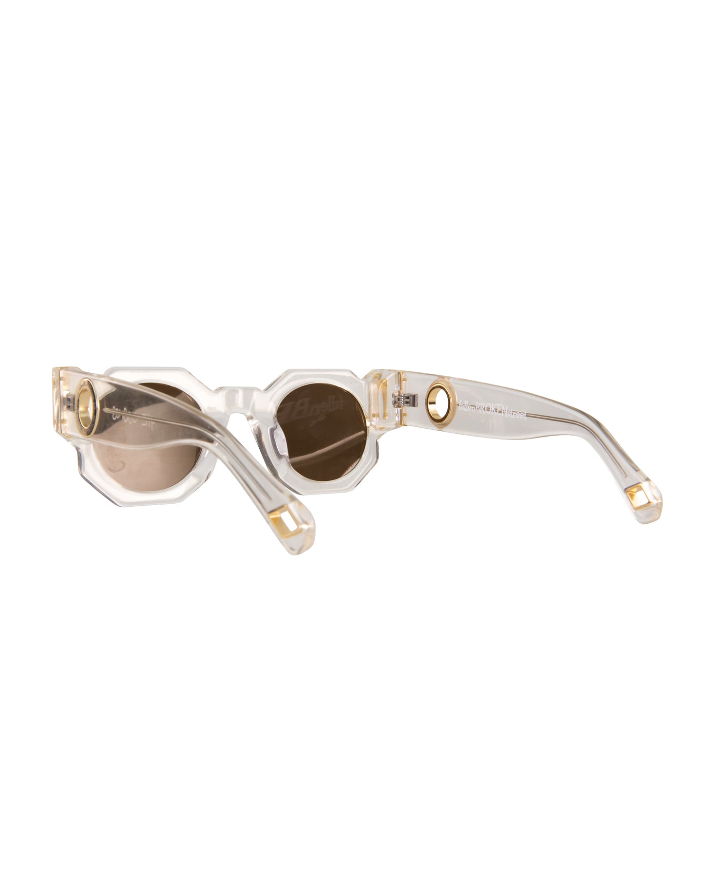 Flat lay from rear angle of The Cosmos sunglasses in Skywalker/Amber. Displays how arms curve behind ears for fit, while showing off structural lines and gold chain ports. Useful for showcasing function and form.