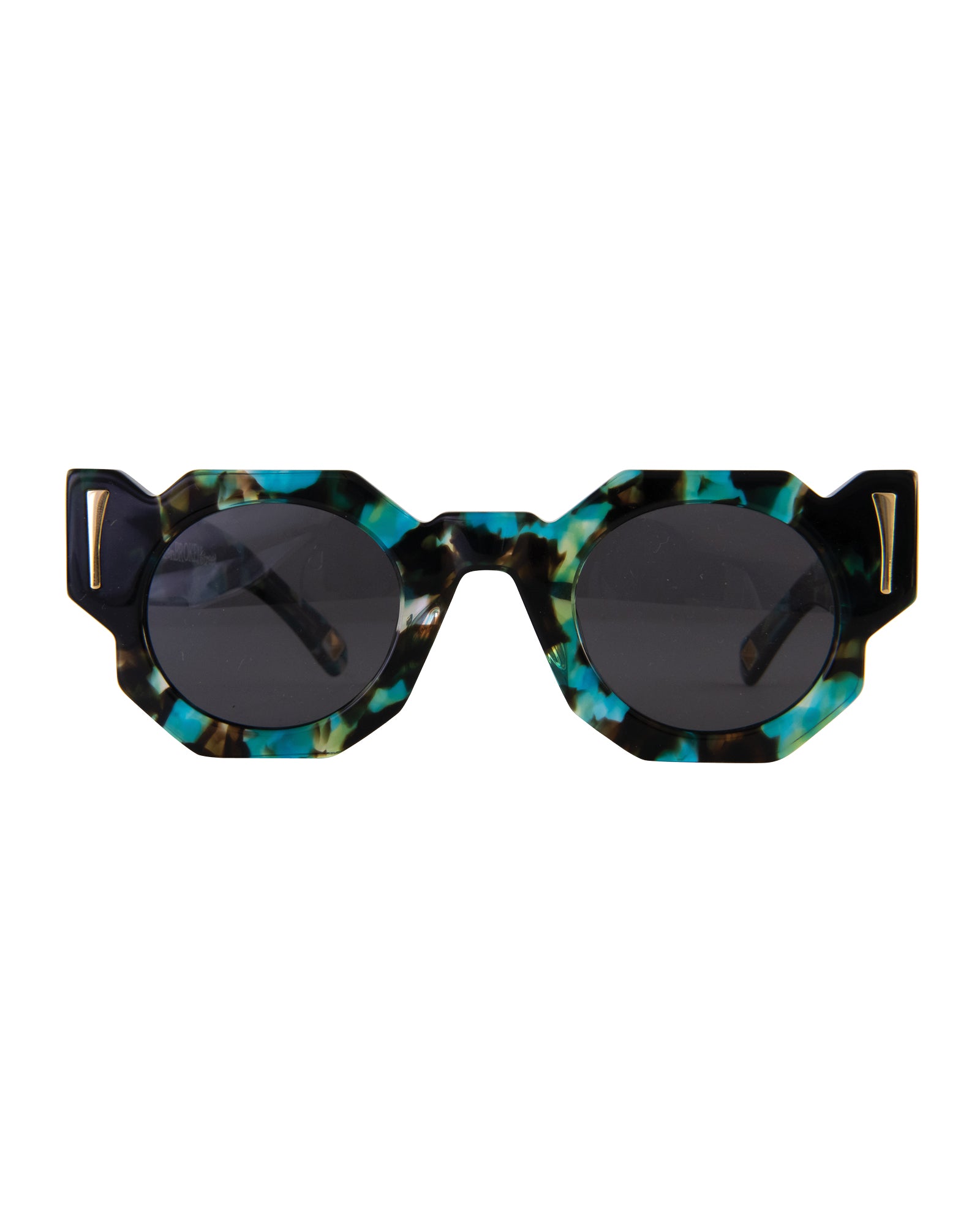 A pair of sunglasses with a patterned acetate frame, polarised lenses, and 24k gold finishings. The sunglasses are displayed in a position where both the front and side views are visible, showcasing the design and style.
