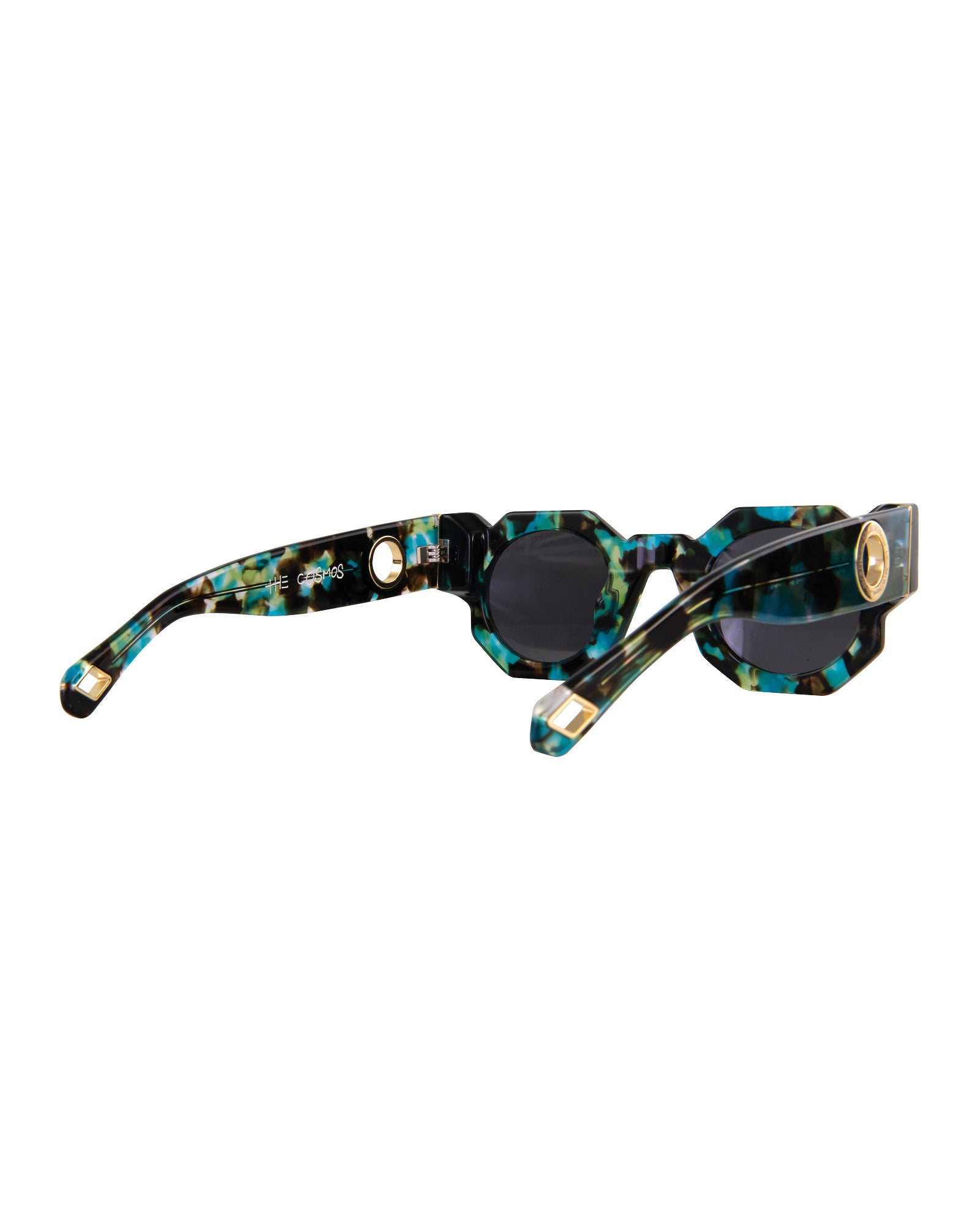 Side-angle view focused on gold ring detailing at the temple tip of the sunglasses. Galaxy colours swirl in acetate, providing an upscale, artistic visual.
