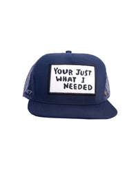 Front view of FBS x Marty Baptist Needed Cap in navy with embroidered statement patch