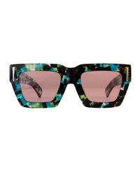 Front view of The Mischief – Galaxy/Pink sunglasses featuring a galaxy acetate frame and soft pink lenses. A bold, square silhouette with 24k gold detailing from Fallenbrokenstreet.