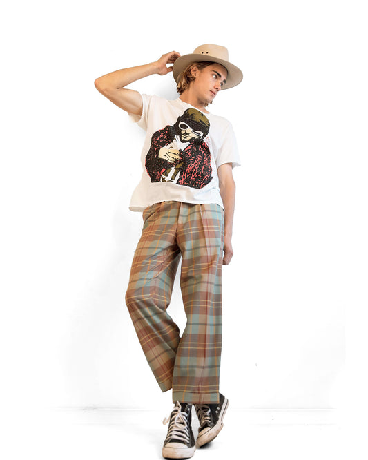 Male model in relaxed, layered styling featuring The Drift feathered hat—a blend of western roots and urban polish.