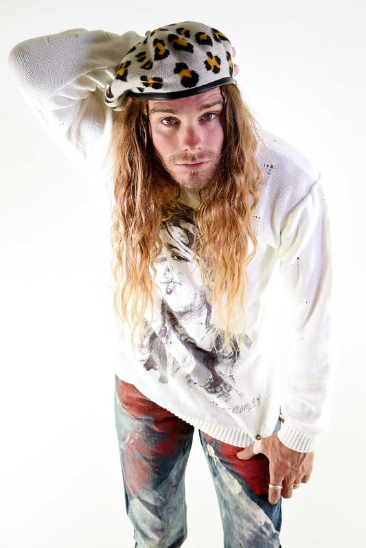 Model wearing The Château Beret – Leopard Print with a casual streetwear outfit, showcasing playful edge and bold personality.