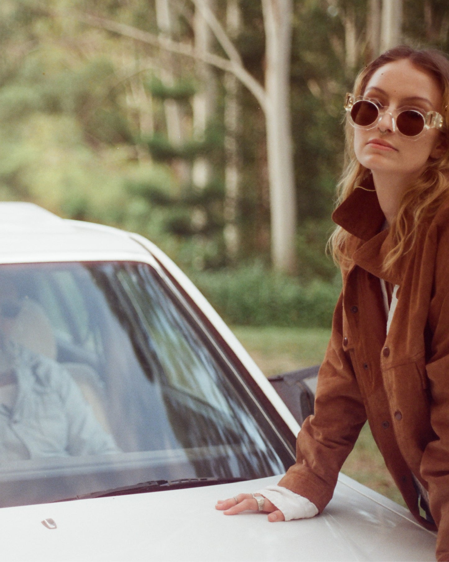 Fashion photo of model in The Cosmos – Skywalker/Amber sunglasses styled with shearling jacket