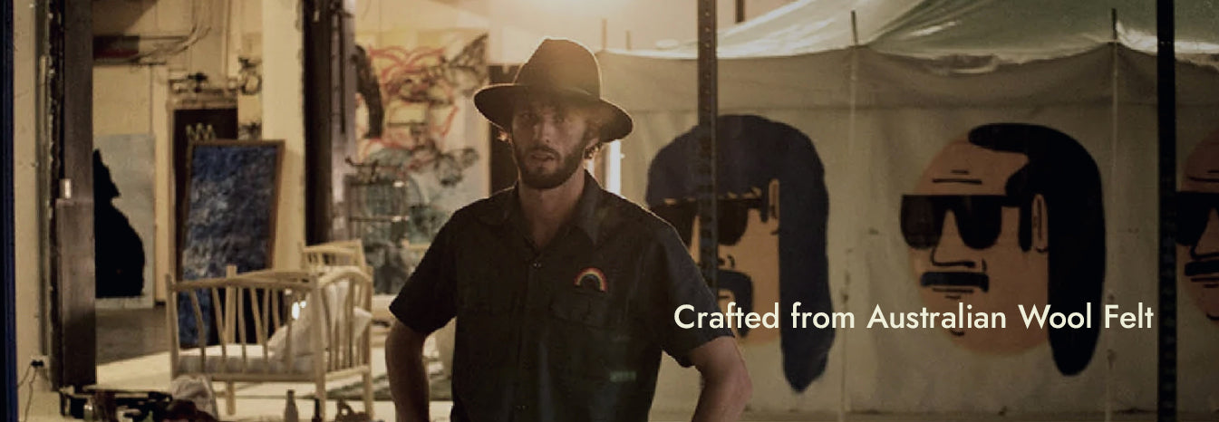 Two women in fallen broken street felt hats for women. One in a black cowboy hat and one in a patterned Australian Wool fedora