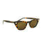 Front three-quarter view of Dope Lemon tortoise shell sunglasses showing bold shape and lens tint.