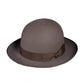 The Bowler Felt Hat by FallenBROKENstreet. 100% Australian wool felt in soft grey with grosgrain ribbon and copper button detail. Structured yet comfortable, featuring a leather inner band with embossed gold logo and UPF 50+ protection.