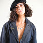 Natural light image showing the beret’s fit and texture on curly hair.

