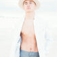 Model wears Cloud Felt Hat, unisex wool felt design with UPF 50+ rating, cotton band, and 4cm brim.
