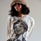 Front-facing view of the model wearing The Cosmic Girl Bucket Hat in Tan Faux Fur. The soft crown and wide brim frame the face beautifully, highlighting the hat’s snuggly fit. Styled for a gender-neutral, casual look that reflects Fallenbrokenstreet’s signature blend of comfort and artistic expression.

