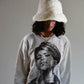 front angle woman wearing david bromly jumper and fluffy faux fur bucket hat