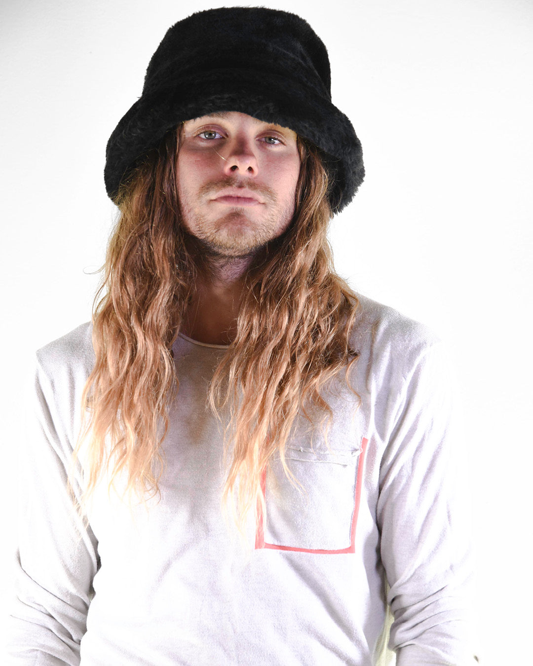 Man wears a fuzzy bucket hat for fallenbrokenstreet