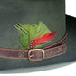The Bromley Felt Hat in Forest Green, showcasing rich wool texture, worn leather detailing, and artisan craftsmanship. A timeless unisex piece inspired by art and adventure.