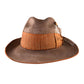 Side view of the EP Vintage Hat – Elmwood colourway, showcasing the burnt orange grosgrain ribbon, feather accent, and softly weathered texture. A timeless piece blending rustic style with elevated detailing.

