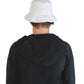 Back view of model wearing The Rusty bucket hat in white. Relaxed cotton silhouette ideal for summer days or festival scenes.

