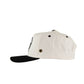 Side angle of FallenBROKENstreet logo cap in white and black

