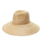 The Holiday Straw Hat by FallenBROKENstreet in natural palm straw. Wide 12 cm brim and 9 cm crown with cotton elastic inner band and metal button detail. A timeless wide-brim summer hat offering UPF 50+ protection and relaxed, coastal elegance.