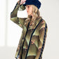 woman wearing a blue corduroy cap
