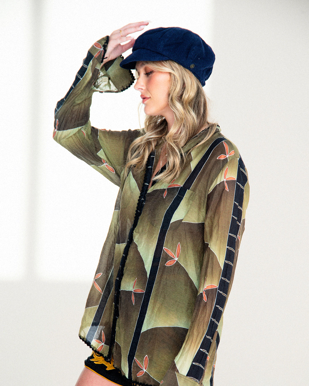 woman wearing a blue corduroy cap
