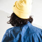 back view of FallenBROKENstreet Lucks Beanie in Buttercup yellow, ribbed knit, flexible fit, signature logo badge.