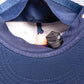 Secret pocket lining inside navy trucker cap

