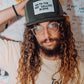"Close-up of model wearing Marty Baptist x FallenBROKENstreet 'Go to the art gallery alone' cap – urban artist style"

