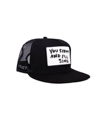FBS x Marty Baptist Strum Trucker Cap in black with embroidered “You Strum and I’ll Sing” patch.