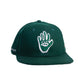 A green flat-brimmed wool felt cap with white embroidered artwork of a hand and an eye on the front.