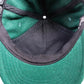 Overhead look at the structured interior of the Miracle Eye green wool cap, showing breathable mesh and lining details. This shot highlights quality construction, hidden stitching, and the craftsmanship that defines FallenBROKENstreet wool caps. Useful for showcasing interior design and quality to customers.


