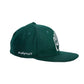 Side angle of the Miracle Eye cap in green, showing embroidered “M. BAPTIST” text. Emphasises the artist signature and premium embroidered finish. A subtle yet essential detail for lovers of artistic accessories and branded collaborations.

